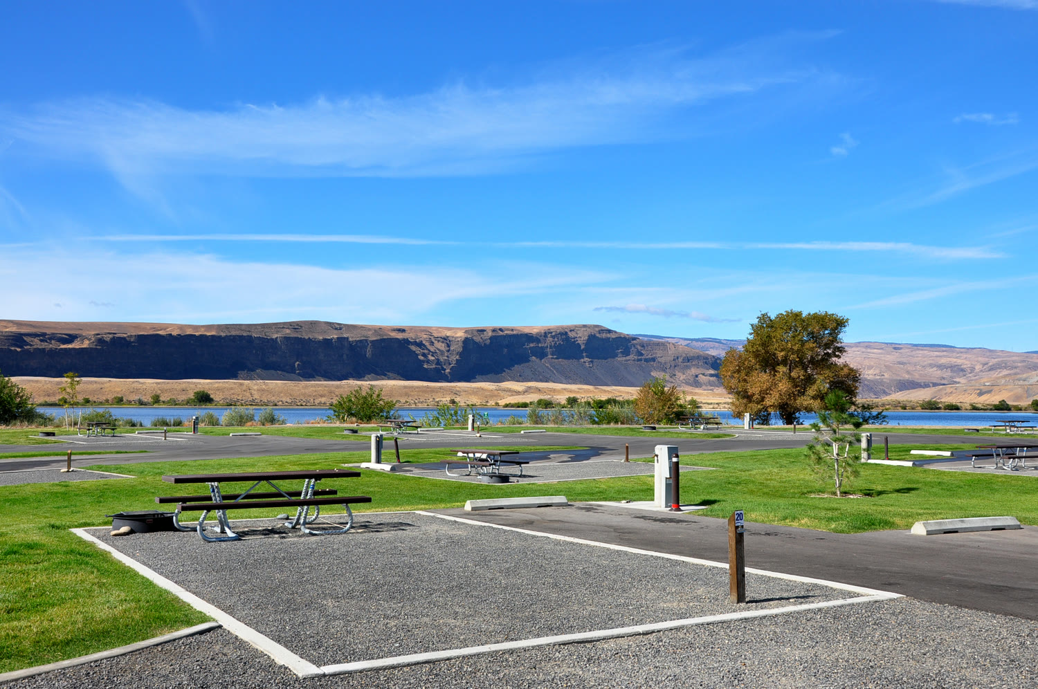 Campsite with picnic table and basalt cliffs